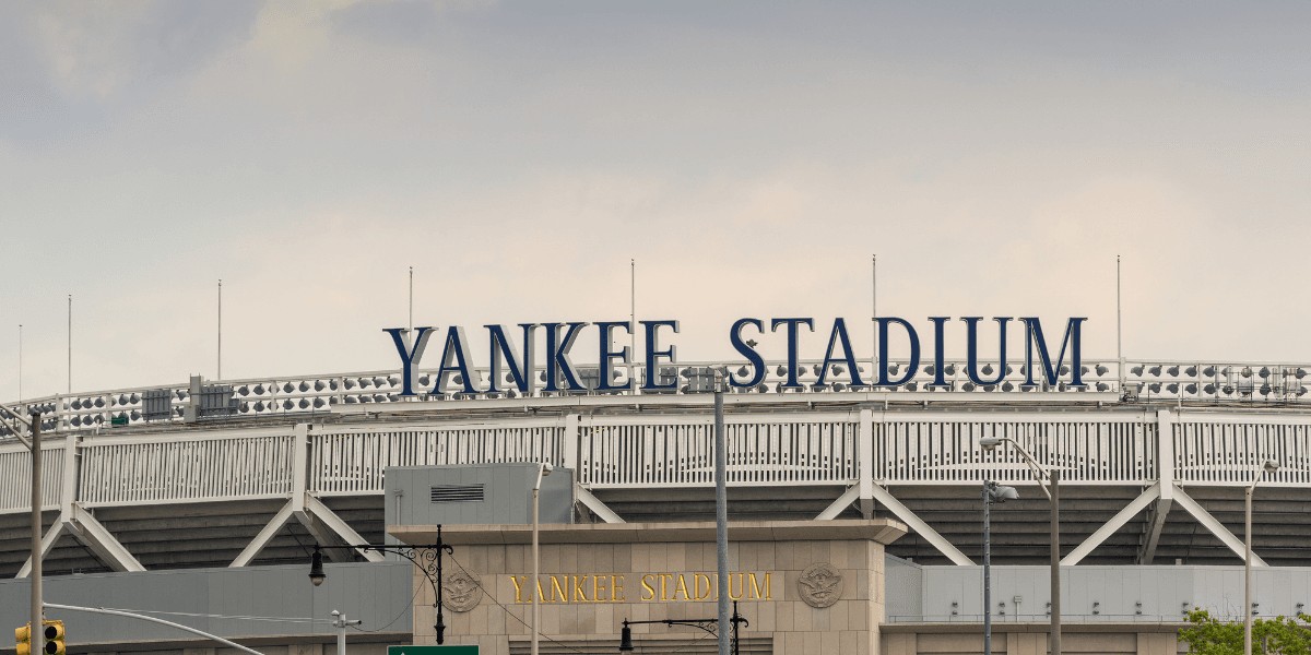 Exterior view of Yankee Stadium with its name prominently displayed on the facade