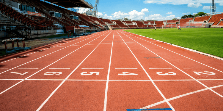 Running track and stadium at Icahn Stadium prepared for track and field competition.