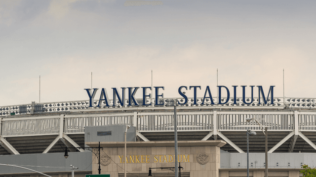 Exterior view of Yankee Stadium with its name prominently displayed on the facade