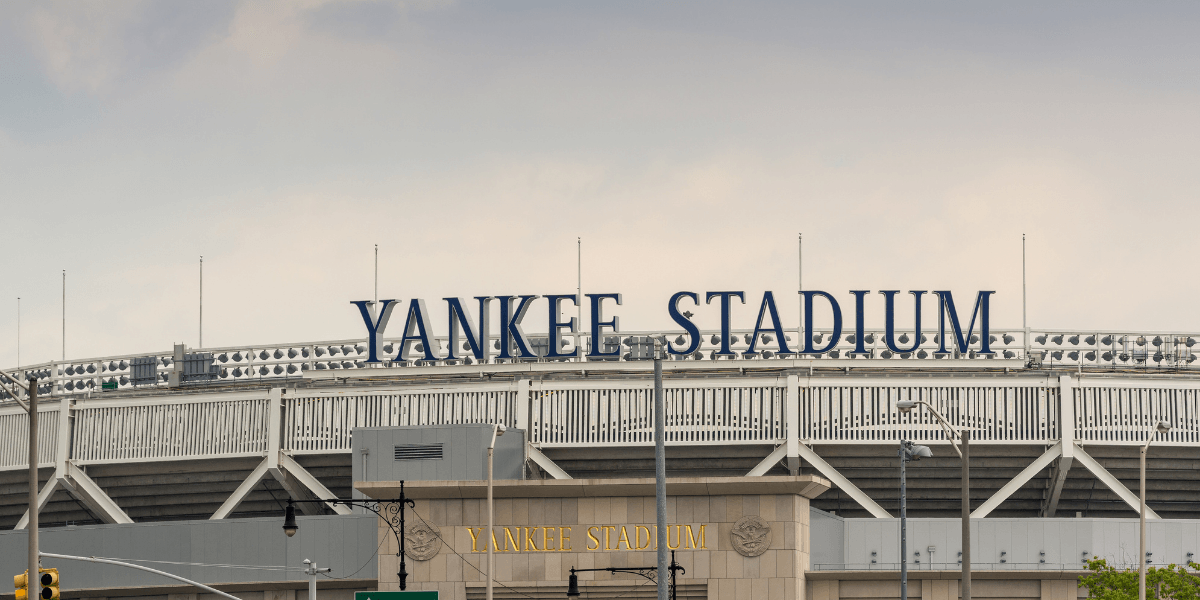 Exterior view of Yankee Stadium with its name prominently displayed on the facade