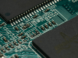 Close-up of a printed circuit board with various components and intricate connections