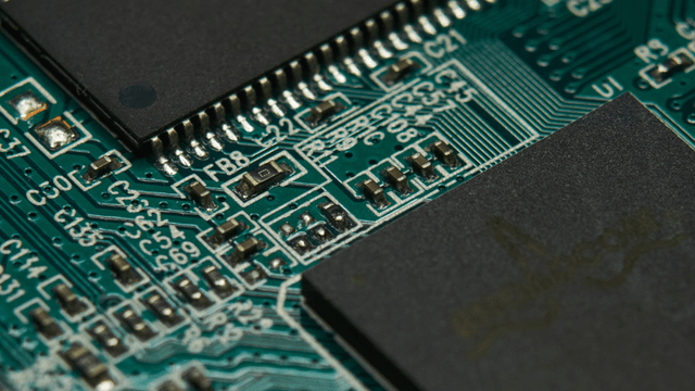 Close-up of a printed circuit board with various components and intricate connections