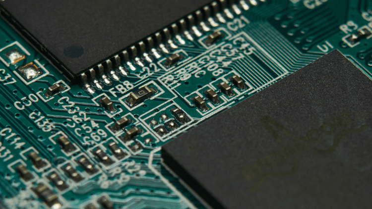 Close-up of a printed circuit board with various components and intricate connections