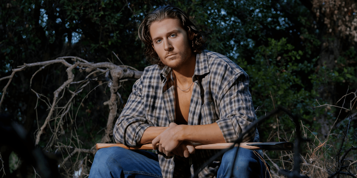 Actor Nate Mayes in nature, showcasing versatility and emotional depth in his creative journey.