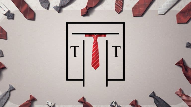 A collection of luxury ties elegantly arranged around a door, showcasing Talisman Tie's blend of craftsmanship and modern style.