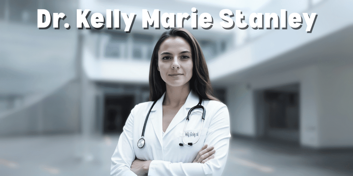 Dr. Kelly Marie Stanley, a confident and professional female doctor, stands with arms crossed in a white coat with a stethoscope around her neck in a modern medical setting.