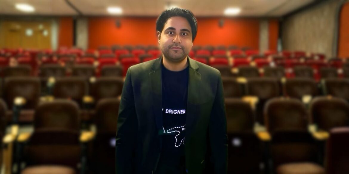 Egyptian filmmaker Mohamed Mamdouh standing in an empty theater, symbolizing his innovative impact on modern Arab and global cinema.