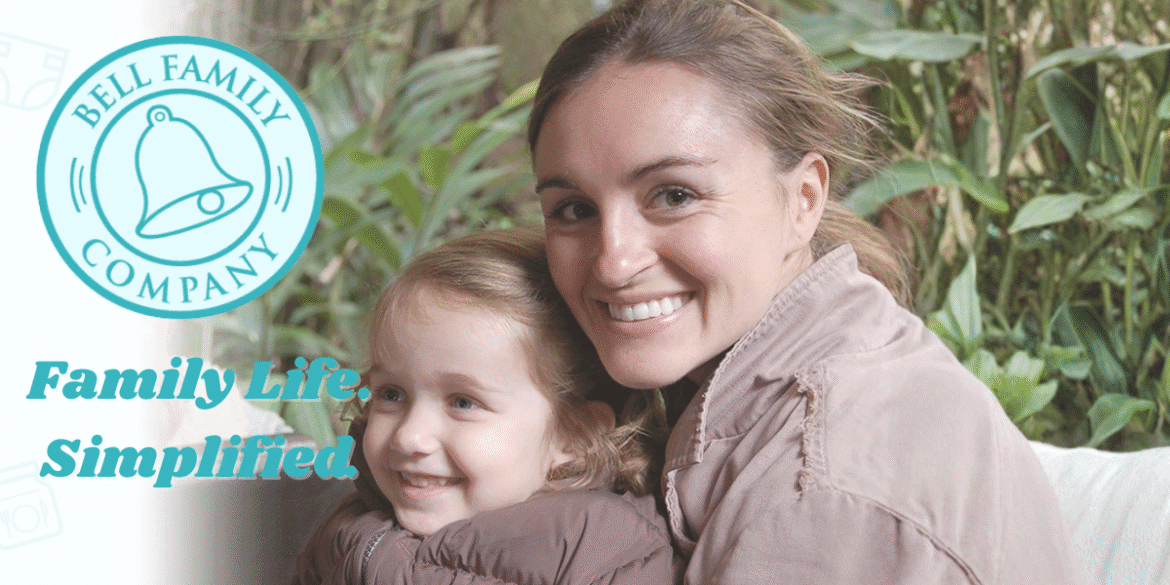 Mother and daughter smiling together in a lush garden, representing family life support provided by Bell Family Company.