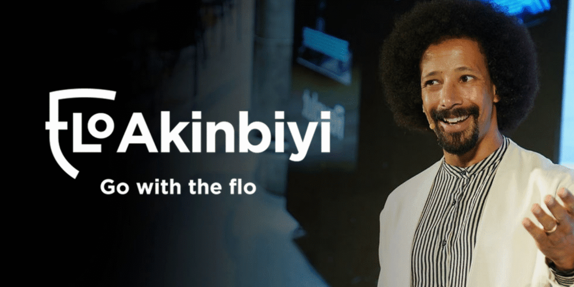 Flo Akinbiyi, dynamic communication coach, speaking at an event, empowering leaders to communicate confidently and effectively.