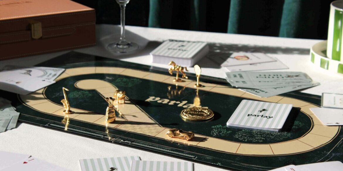 A table set with a game board, cards, and a glass of wine, inviting social interaction and engaging gameplay.